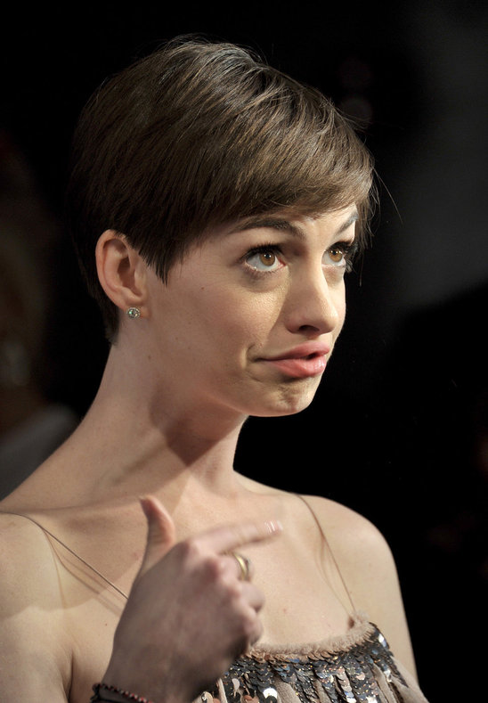 Anne Hathaway's I'm-with-stupid face...